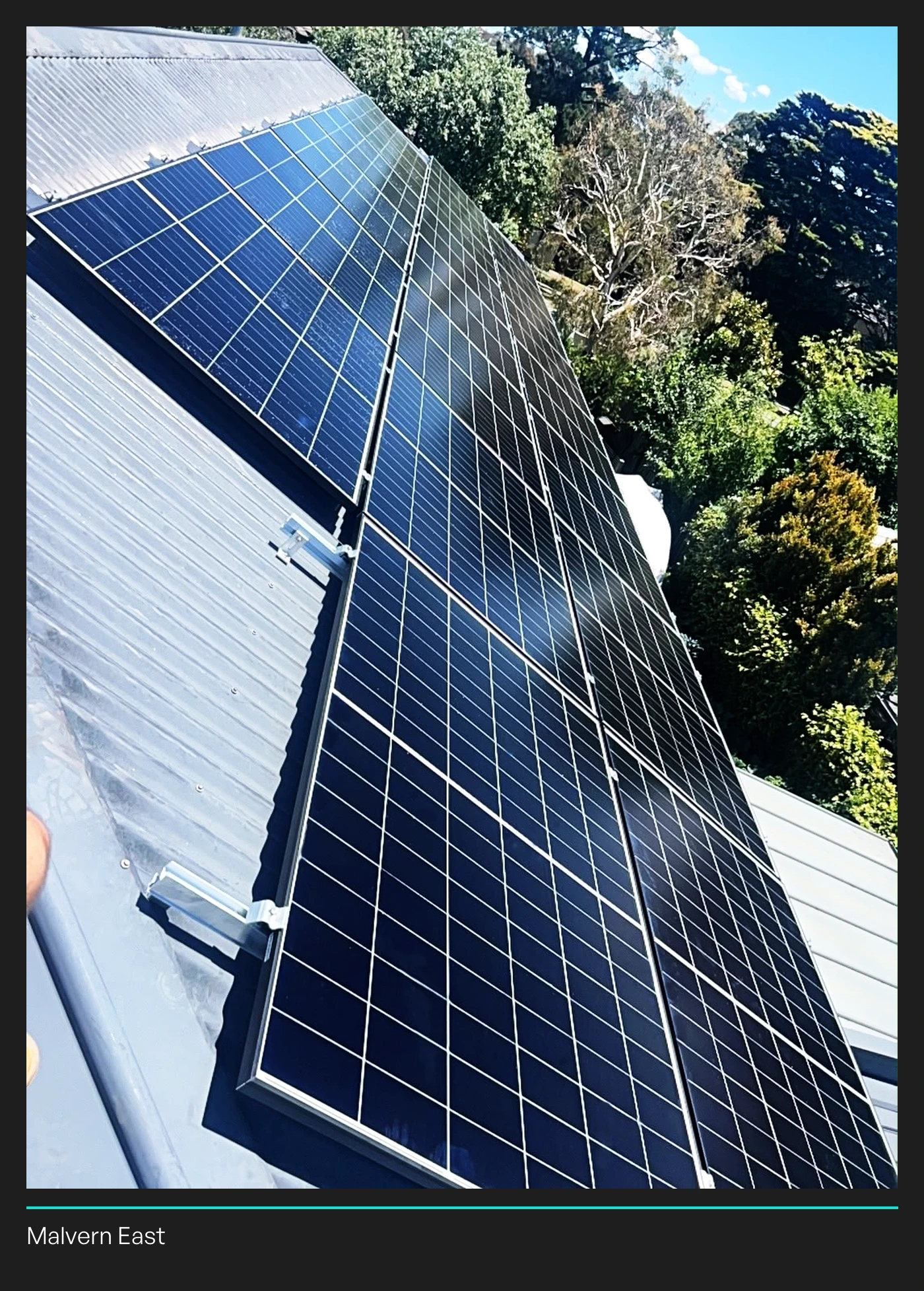 Trina panels on a metal roof in a Lightning Energy installation photograph identified as Malvern East.