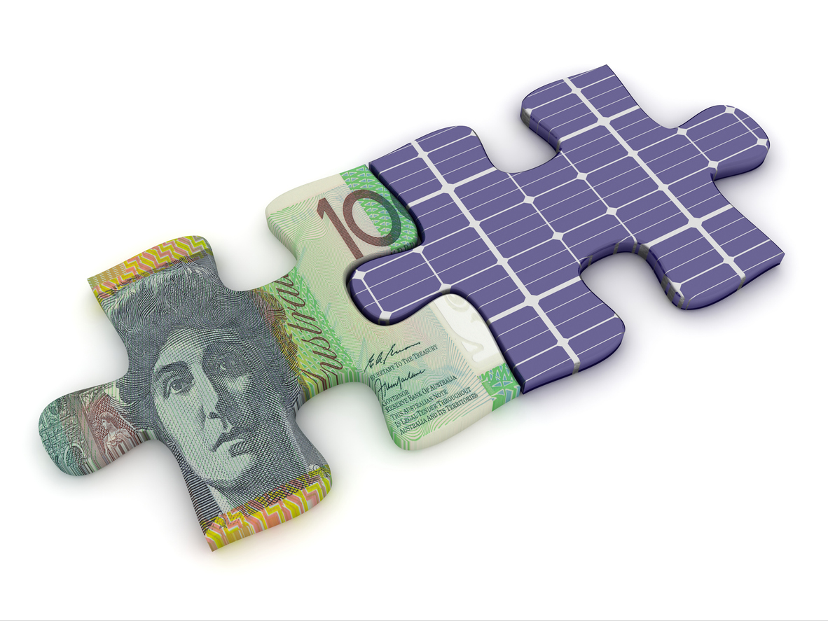 two puzzle pieces, one made of solar panels, the other made with a $100 bill