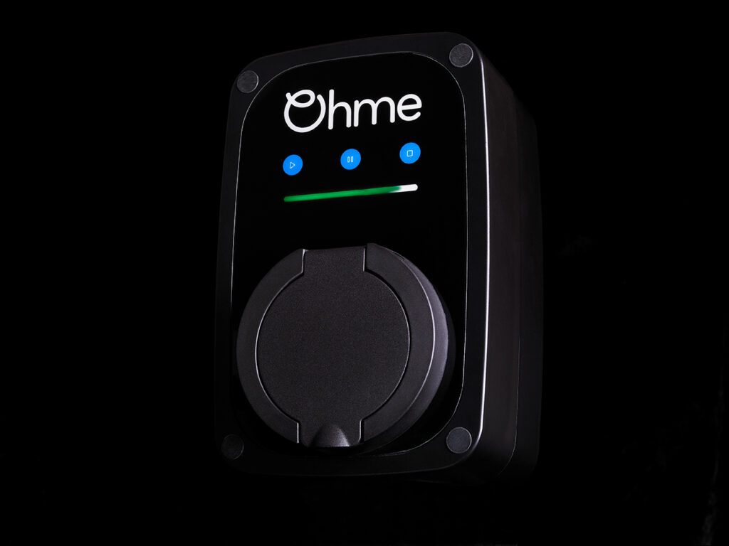 The Ohme ePod is an almost all black EV charger, shaped like a rounded cube, has the Ohme cursive logo in white at top centre, there's 3 blue button underneath that and a big black flap covering the charging hole at the front of the unit. Avaialble for supply and install available by Lightning Energy in Melbourne & Brisbane!